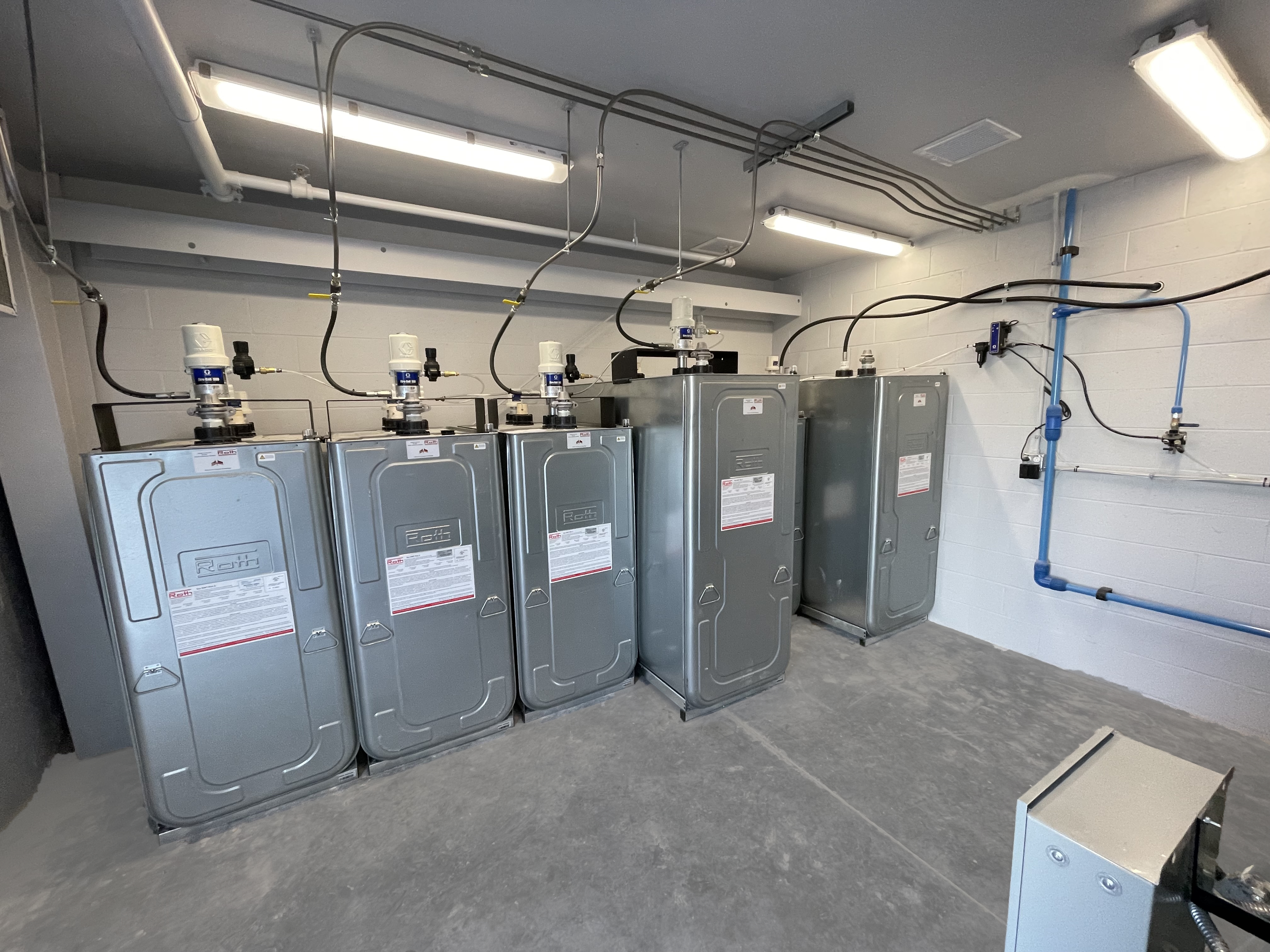 A room full of stainless steel heaters lined up